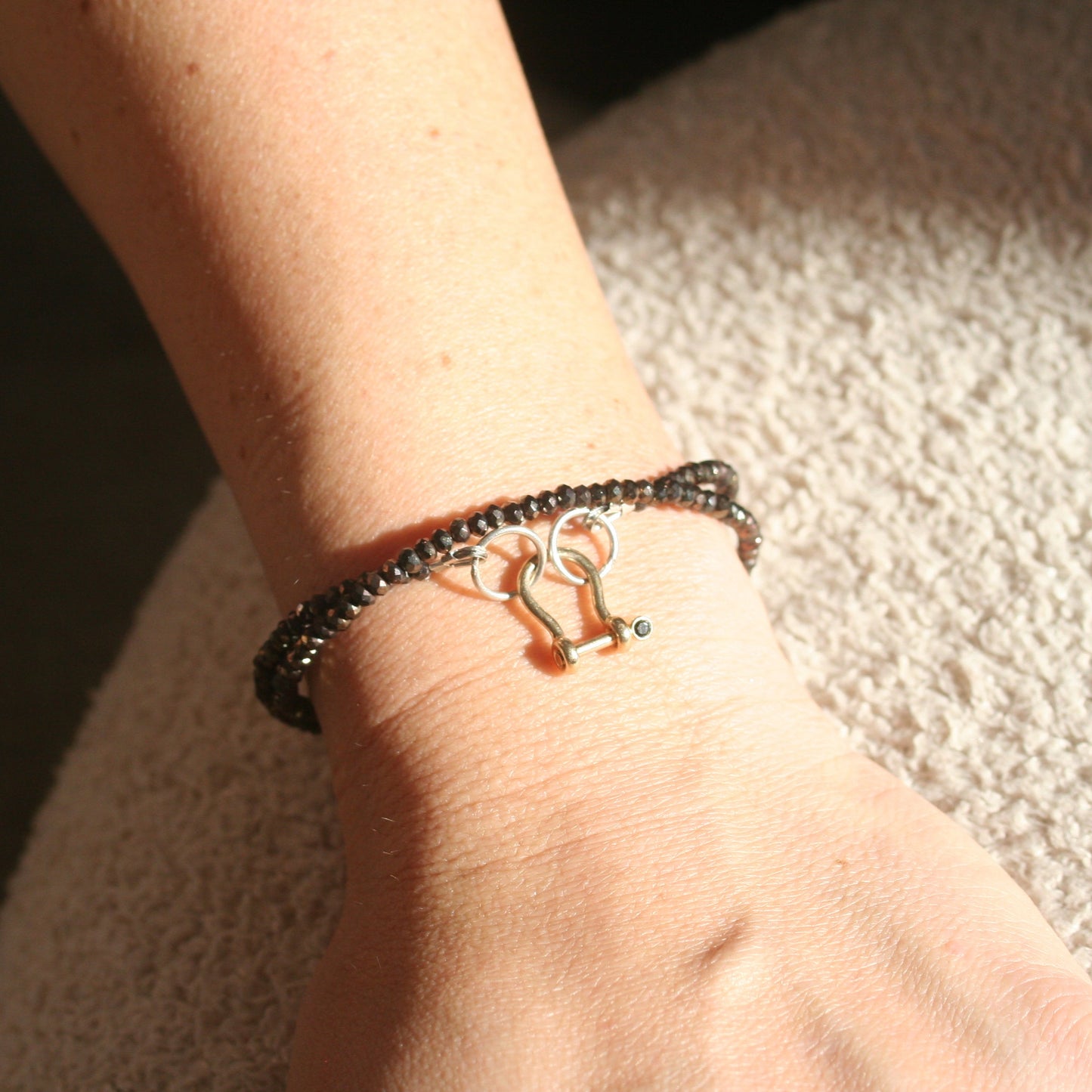 Shackle clasp charm