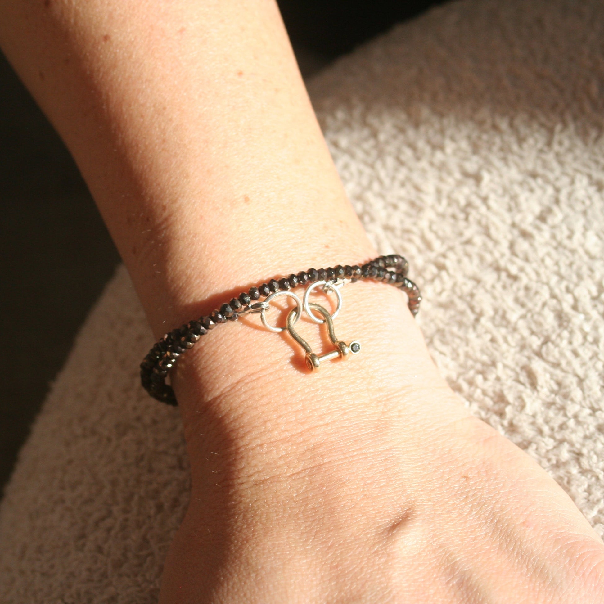 Shackle clasp charm
